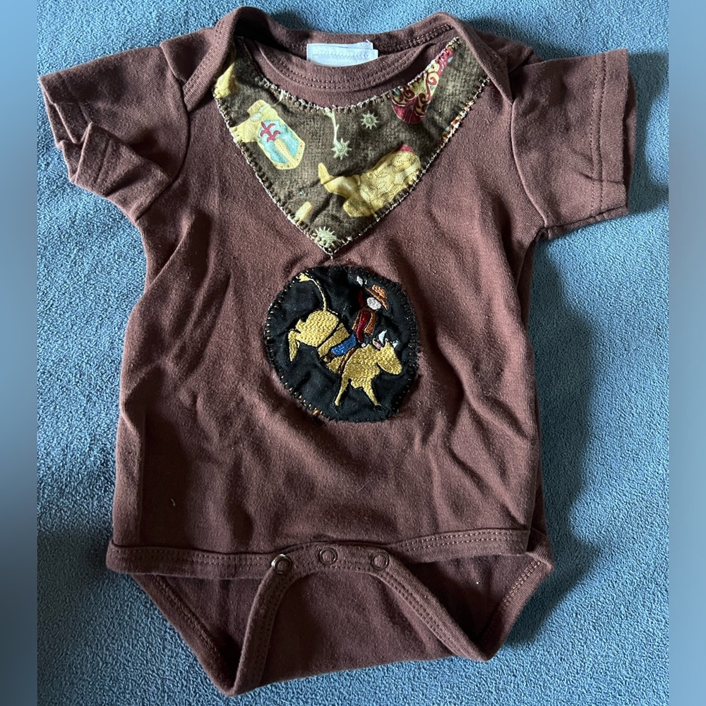 Short, sleeved, cowboy bodysuit.